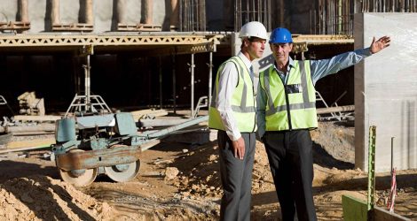 two-construction-workers-discussing-plans-on-site-2024-06-05-18-36-48-utc_11zon.jpg